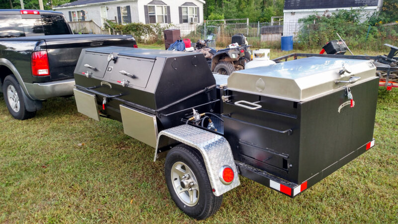 Gas Pig Roaster on Custom Trailer With Doors in Lid and Stainless Steel Folding Shelves