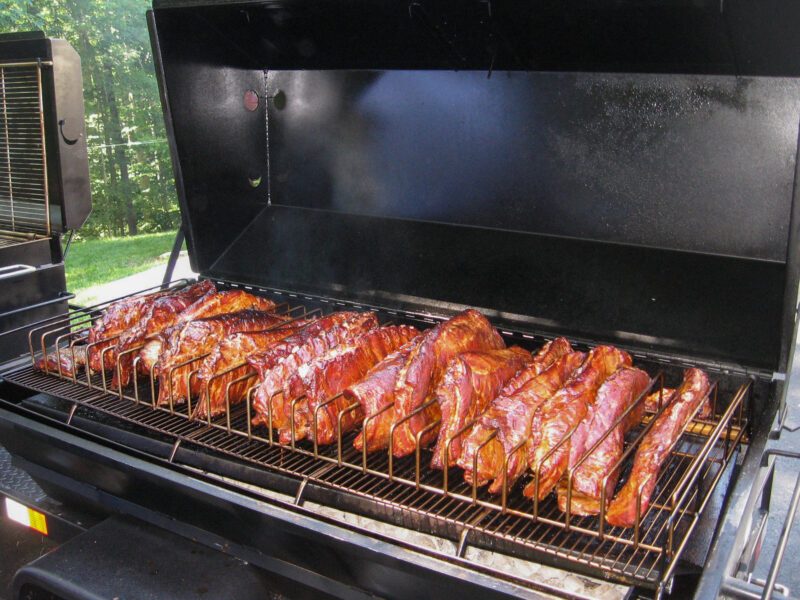 Pork Ribs on a Meadow Creek Pig Roaster and Meadow Creek BBQ42 Chicken Cooker Trailer