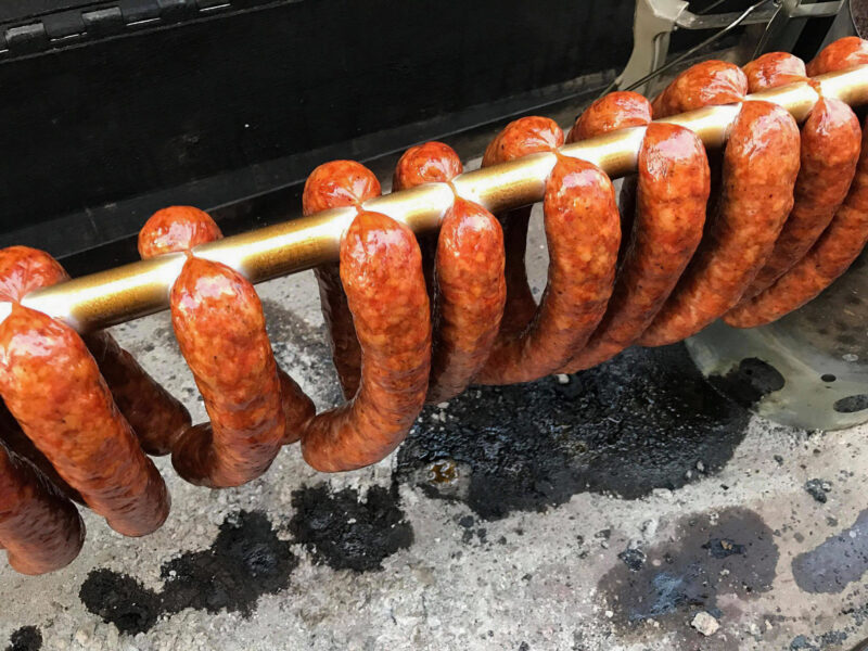 Grilled Sausages on a Meadow Creek Pig Roaster