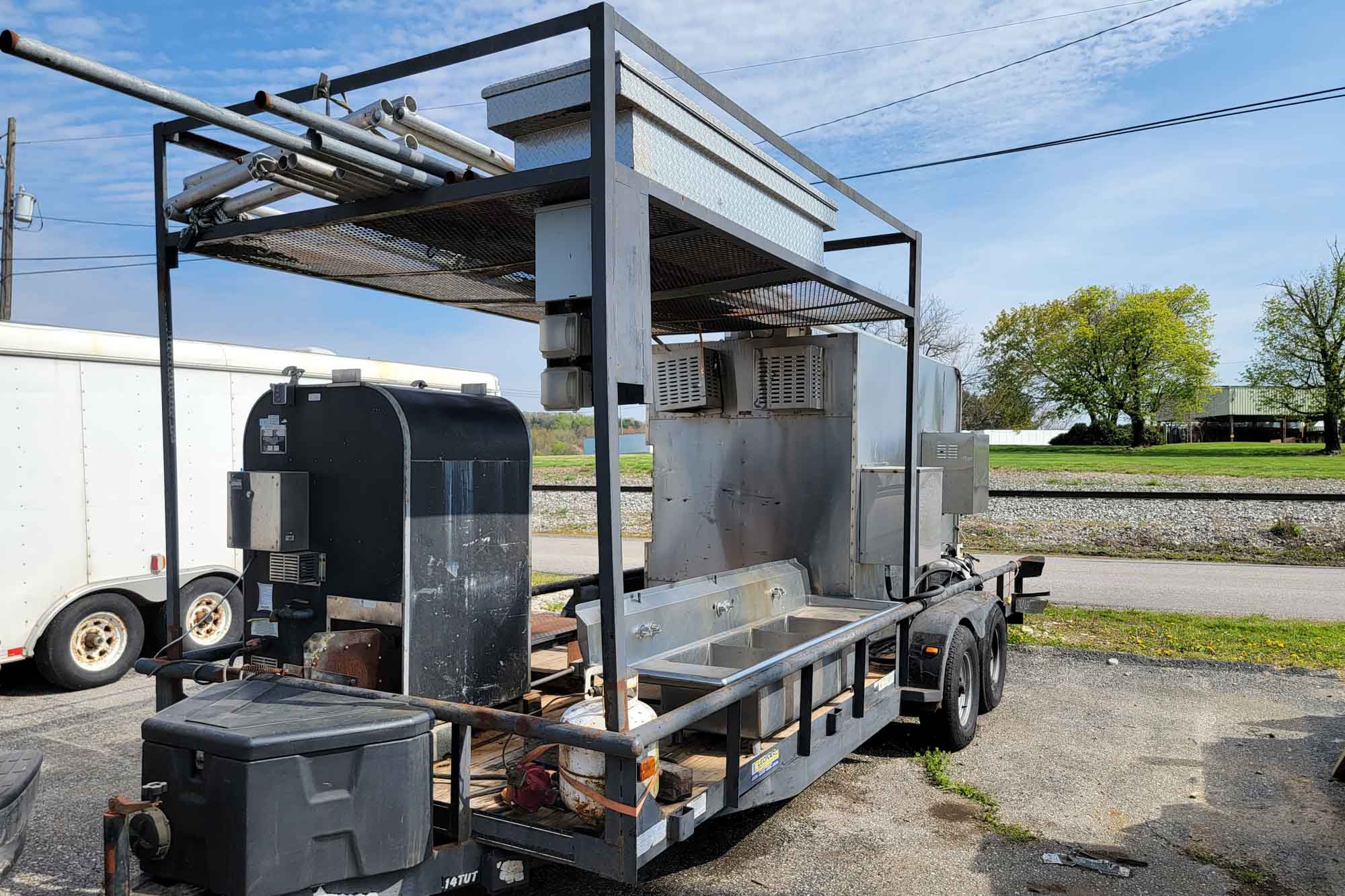 20' Double-Axle Trailer with SPK 1400 Southern Pride, Old Hickory Smoker 100, 3-Bowl Sink, and Tent Parts